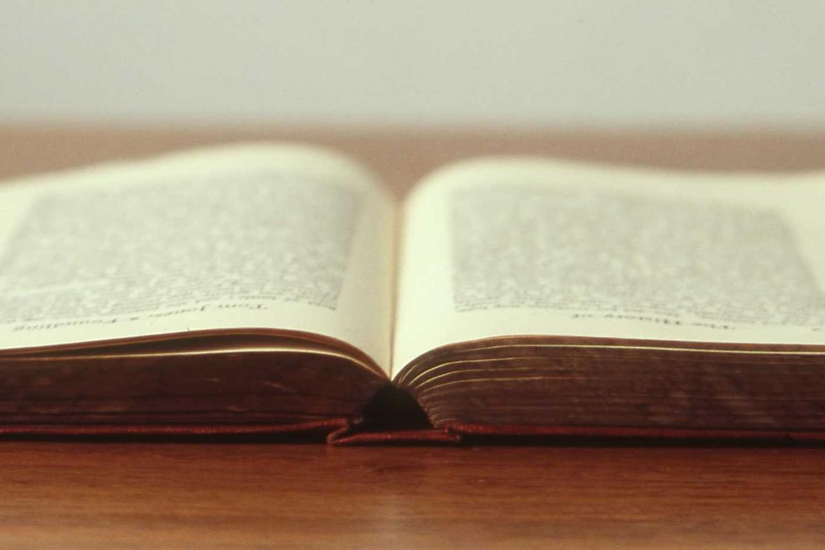 Open notebook with pen ready for action-item capture
